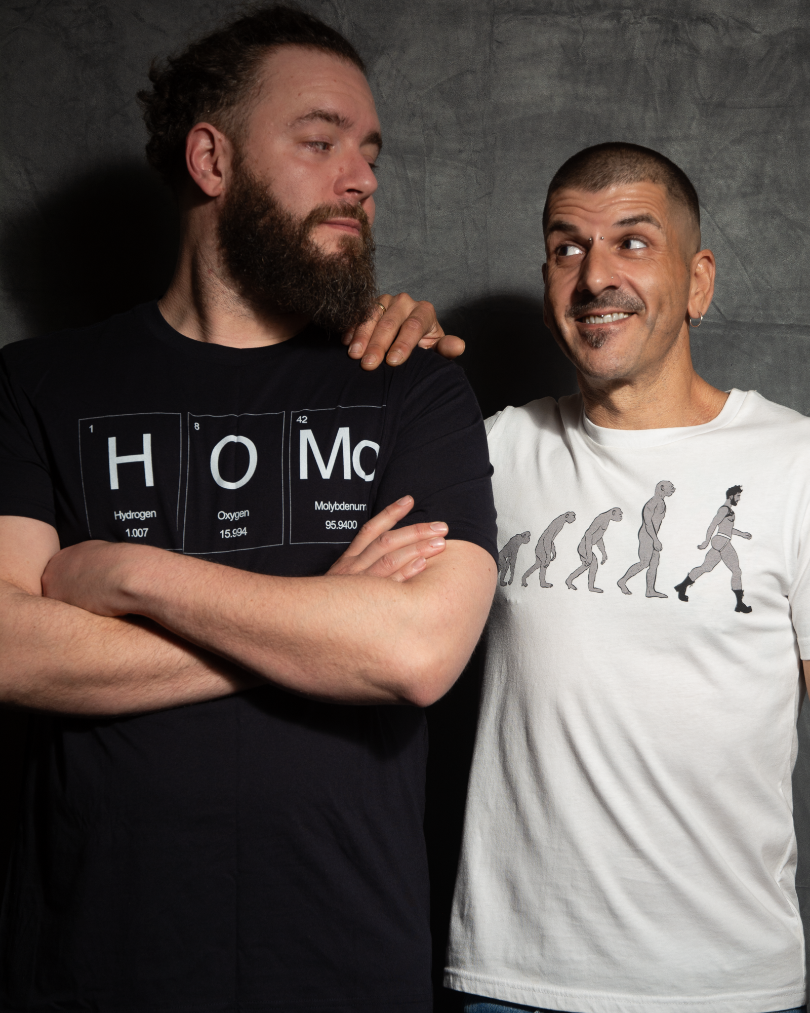 2 gay men smiling at each other