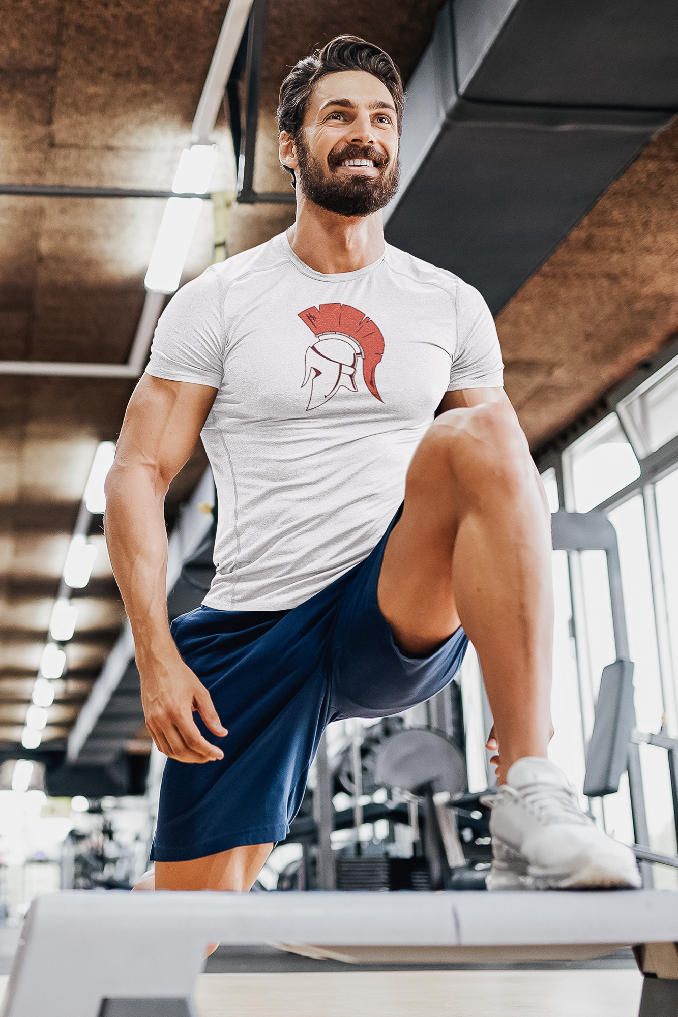 Fit, bearded middle aged man working out in a fitness studio