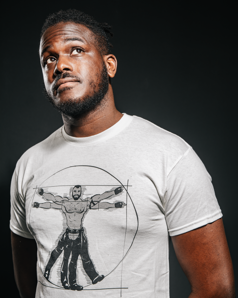 Young black man wearing a gay vitruvian T-shirt from Unapologaytic