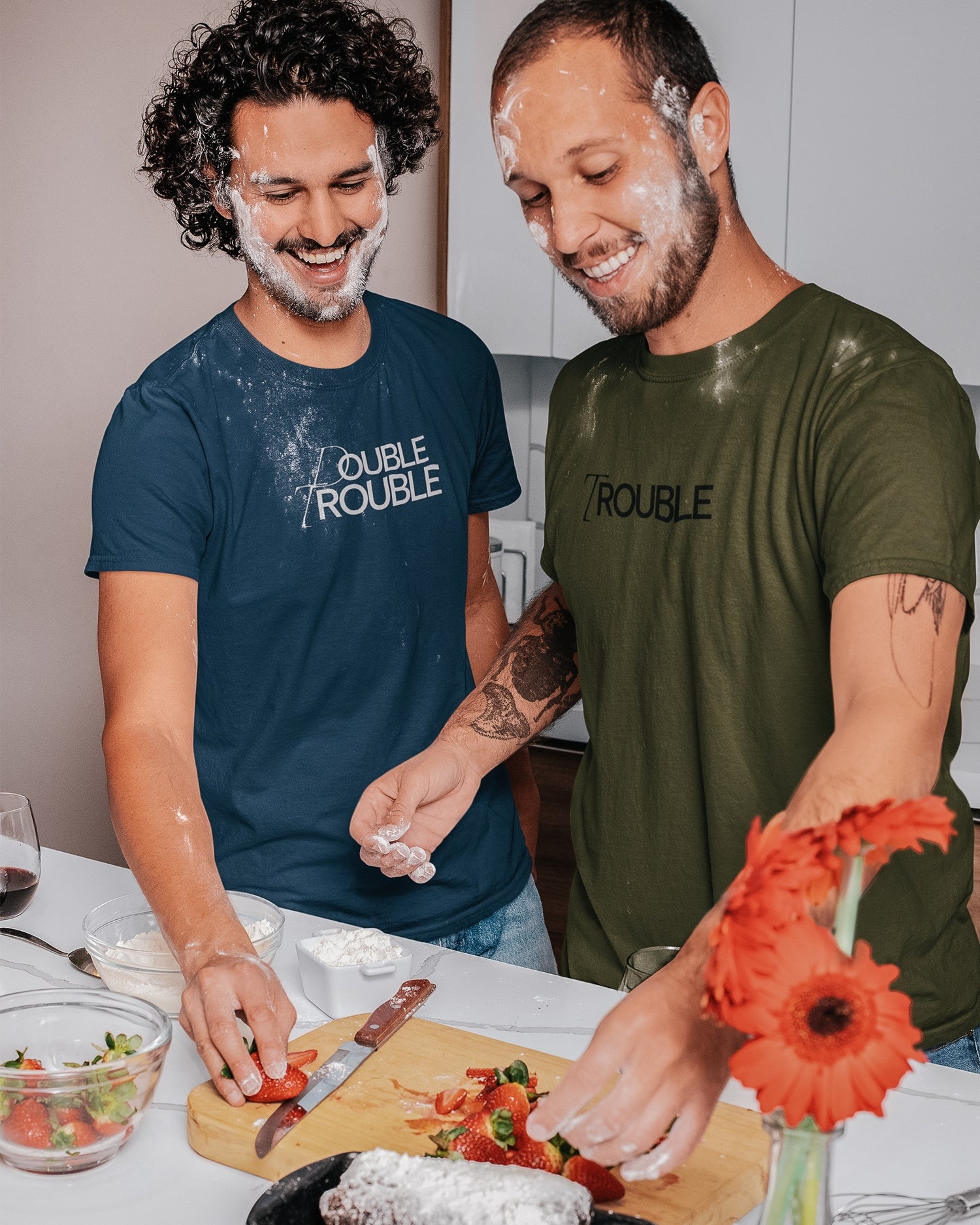 Gay couple wearing matching Unapologaytic T-shirts 