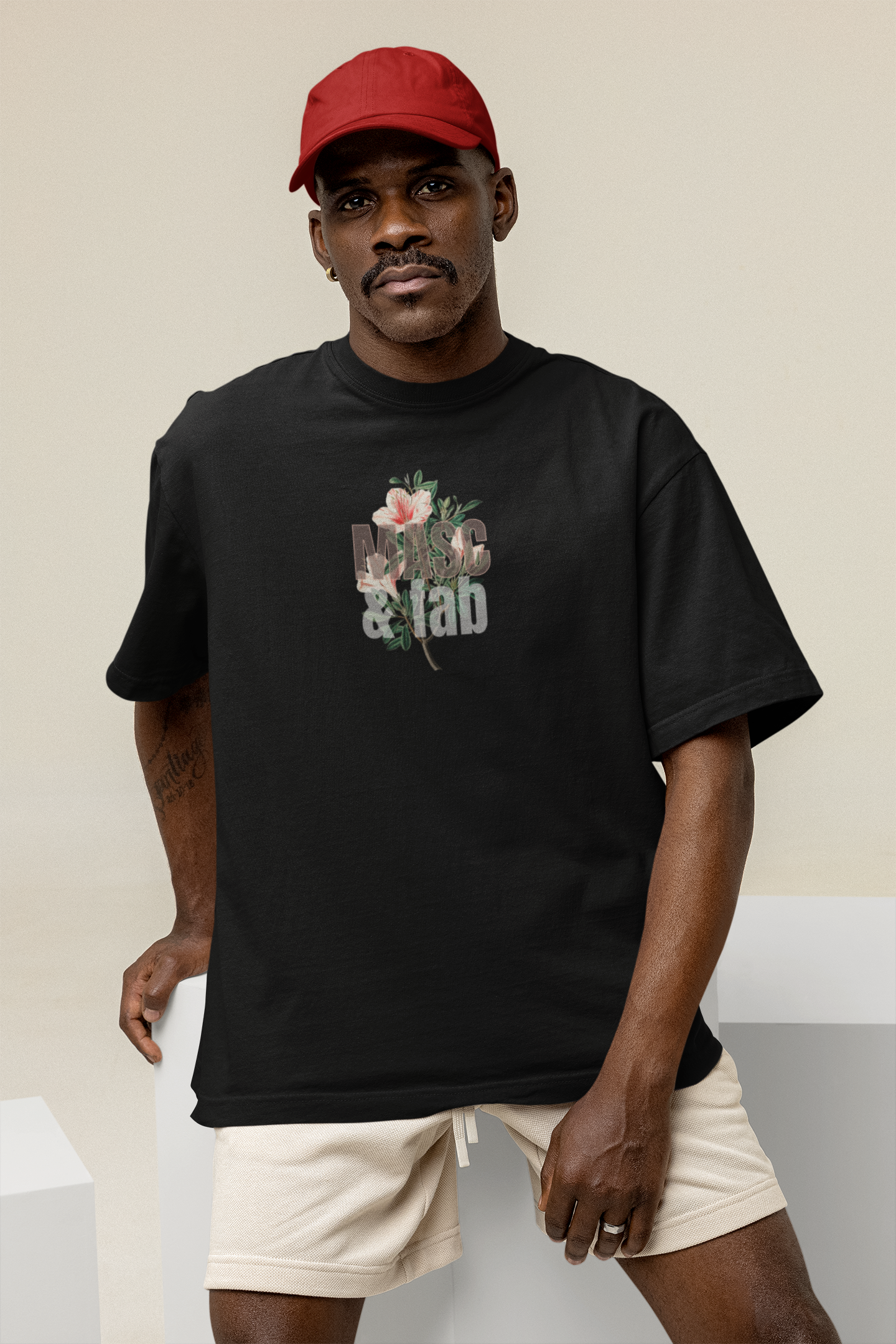 Handsome man wearing a T-shirt reading masc and fab slogan