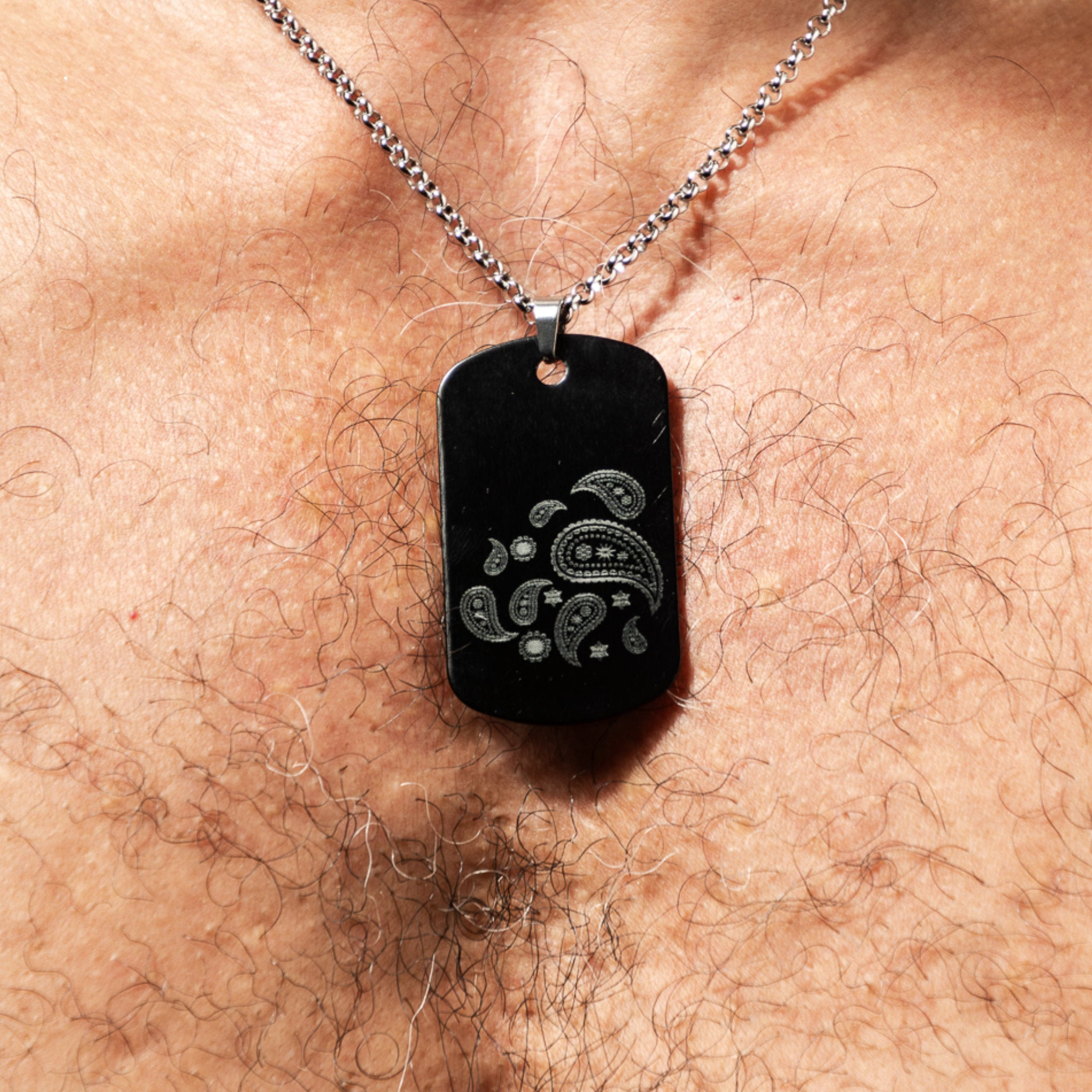 NEW Hanky Code Black Aluminium Tag on a hairy bare chest