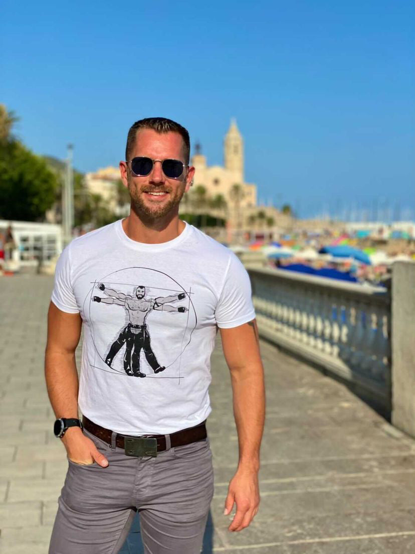 handsome young man wearing Gay Vitruvian T-shirt from Unapologaytic on holiday