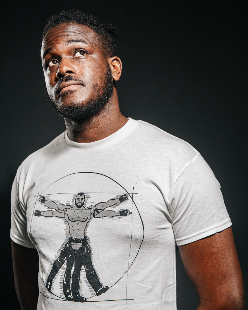 Young black man wearing a gay vitruvian T-shirt from Unapologaytic 