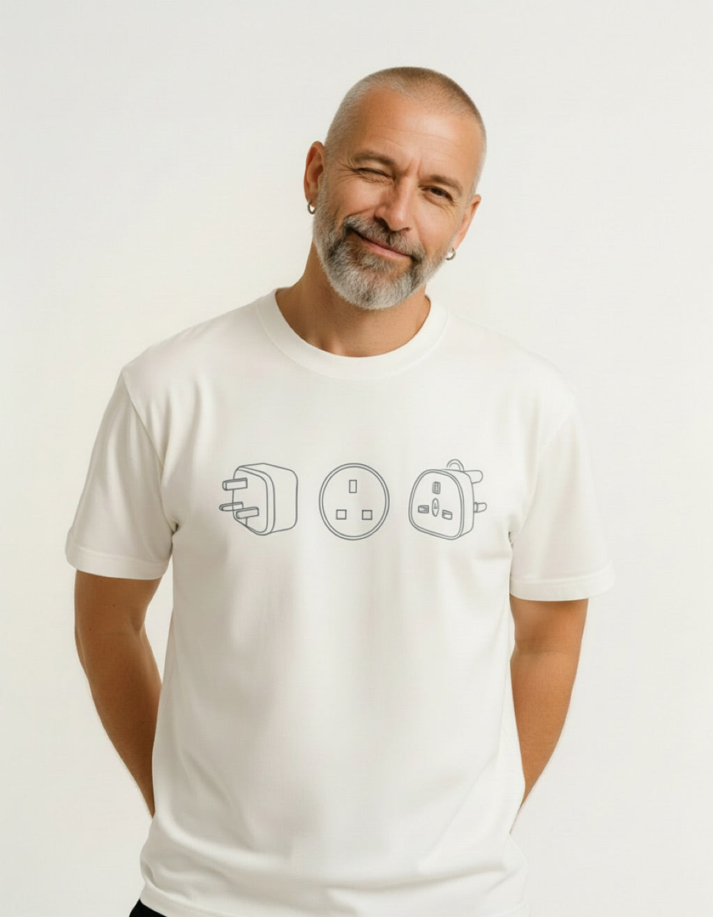 Man wearing a white t-shirt with electrical symbol design on a plain background