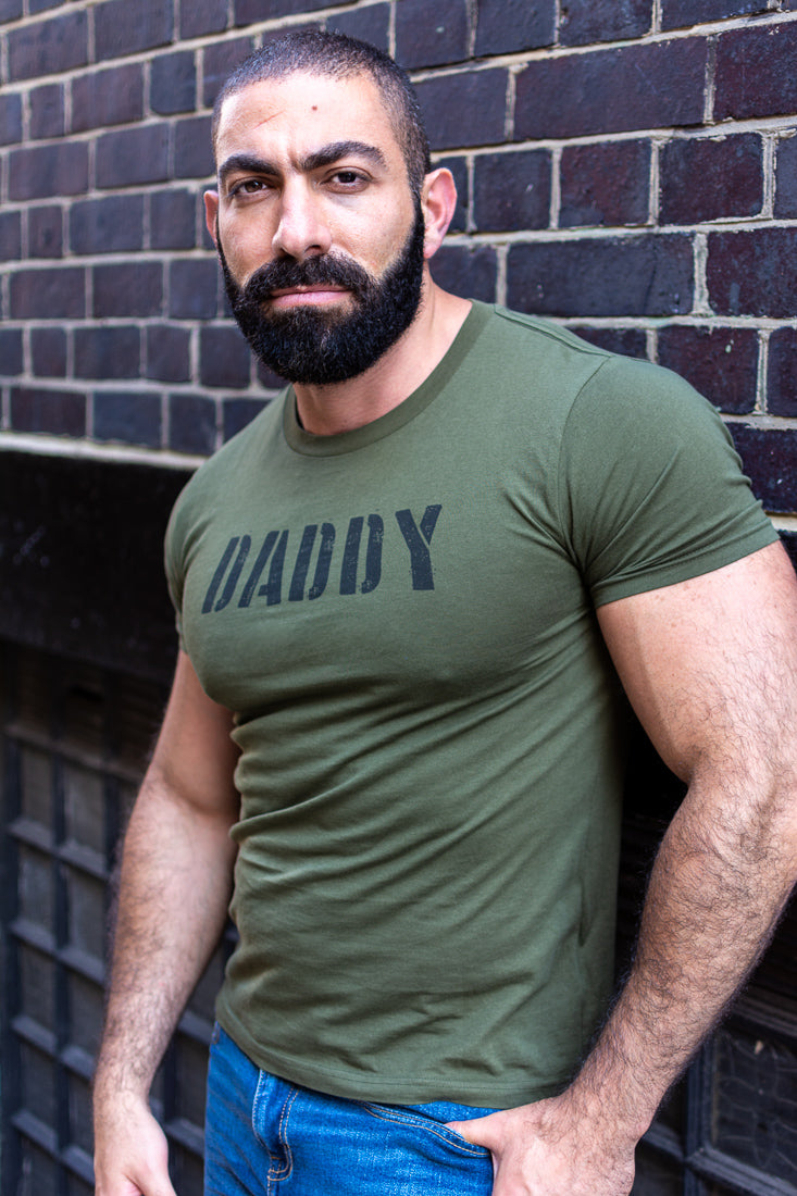 Nader wearing the army green Daddy Organic Cotton T-Shirt 