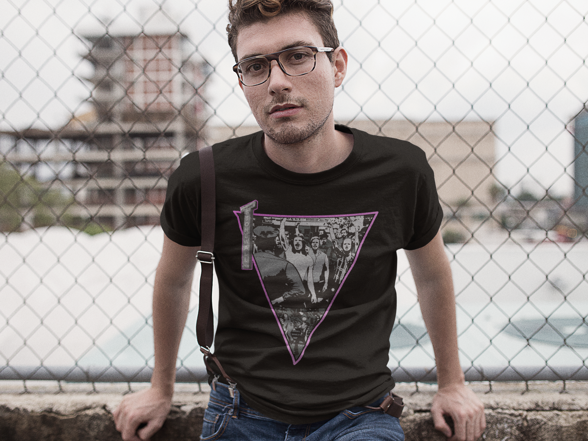 Hipster wearing a Gay T-Shirt commemorating the Stonewall riots